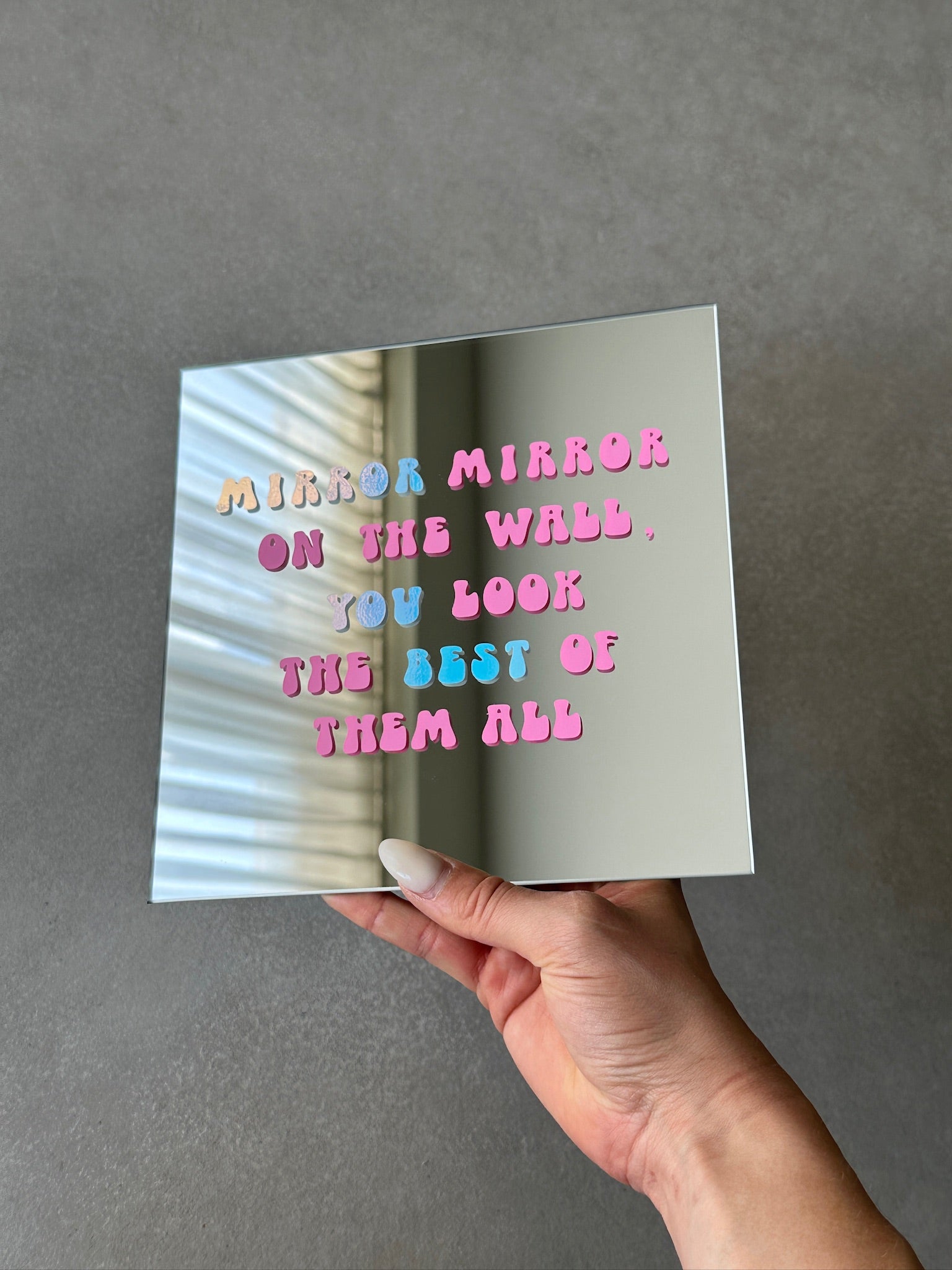 On the wall mirror pink holo