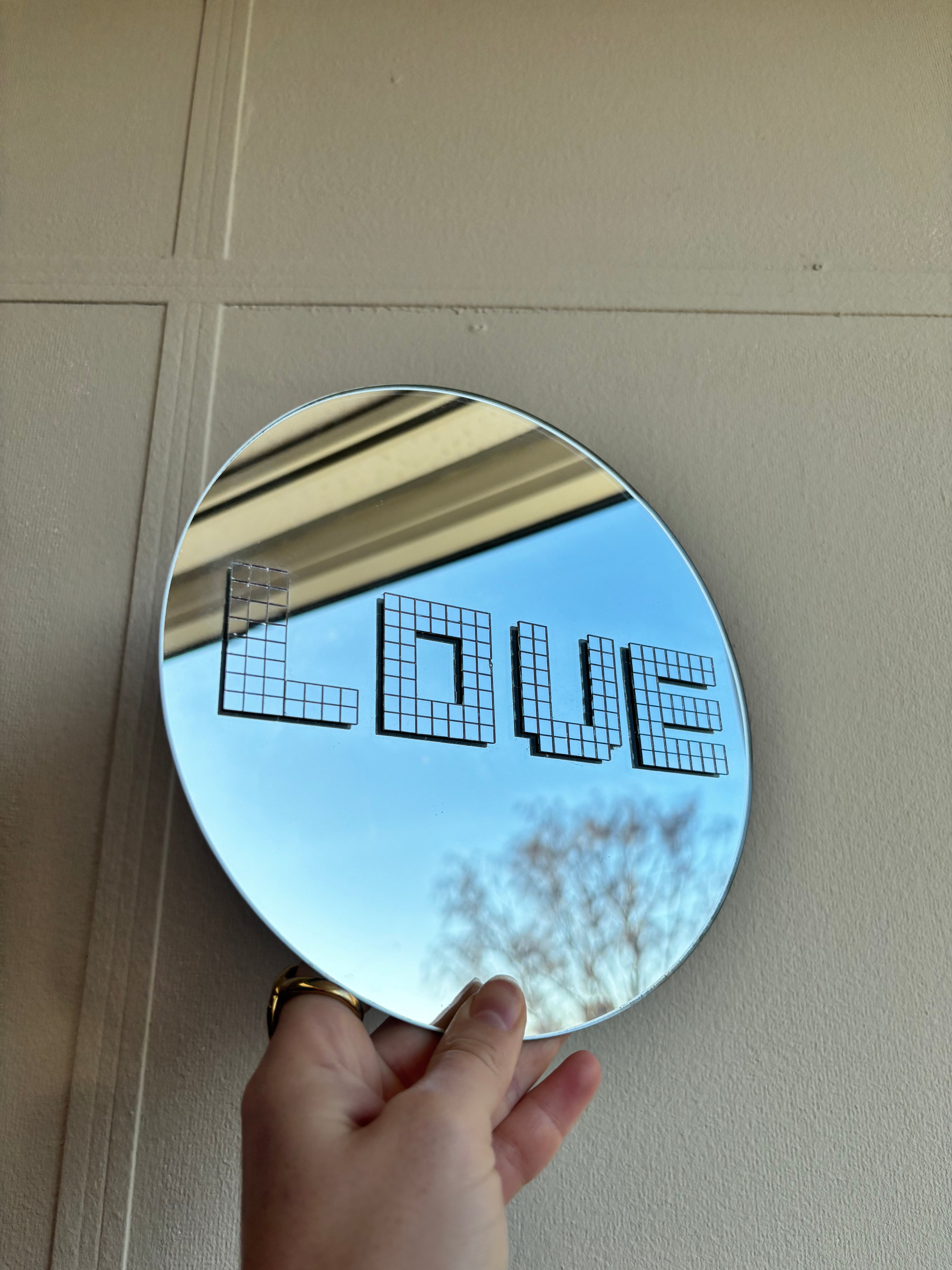 Damaged disco Love round mirror